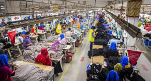 Circular Knitting Machine in operation, High-Speed Textile Machinery in Bangladesh RMG factory. HONGKYMA Flat Knitting Machine for sweater production, Advanced Textile Automation and high-value knitwear DTF Printing Machine for apparel, Sustainable Digital Printing Technology in Bangladesh. REDSUN Sewing Machinery in garment line, Industrial Garment Automation and assembly. BBT EAE Controller panel, Textile Factory Energy Efficiency and power management.